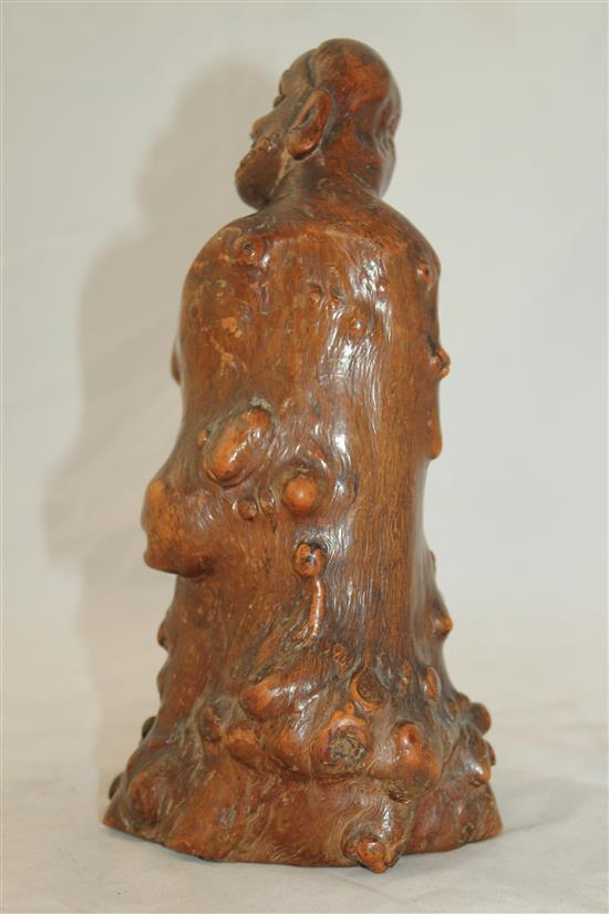 A Chinese rootwood carving of a luohan, 18th century, 23cm